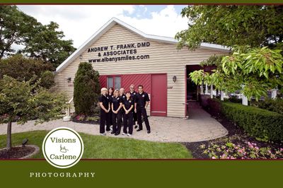 Dental team group photo outside Andrew T. Frank DMD & Associates