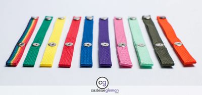 Tomato Snaps plant ties fanned out in multiple colors on a white background