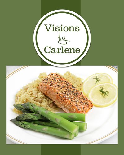 Plated pepper-crusted salmon with rice pilaf, asparagus, and lemon
