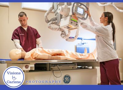 Two radiology technicians operating an X-ray machine